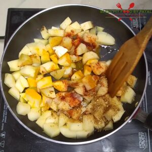 add spices to potatoes